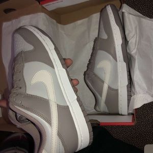 Nike moon fossil dunks.